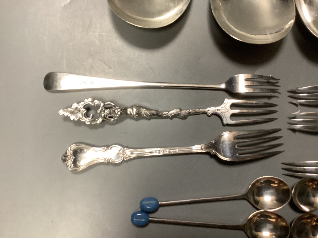 A pair of George V silver serving spoons, Sheffield, 1916, a pair of similar salad servers, a 800 fork, five other silver pieces of cutlery and seven plated items